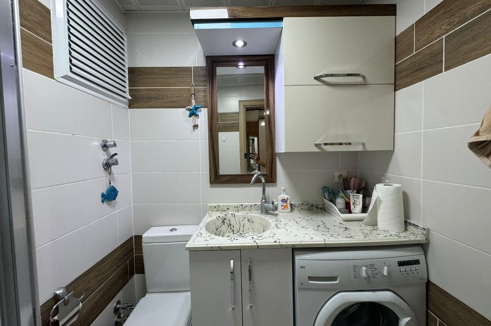 KARŞIYAKA'DA MERKEZİ KONUMDA AÇIK MUTFAK 1+1 SATILIK DAİRE