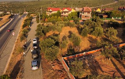 EZİNE GEYİKLİ’de 597 m2 Konut + Turizm İmarlı Yola Cepheli, Denize Yakın Arsa