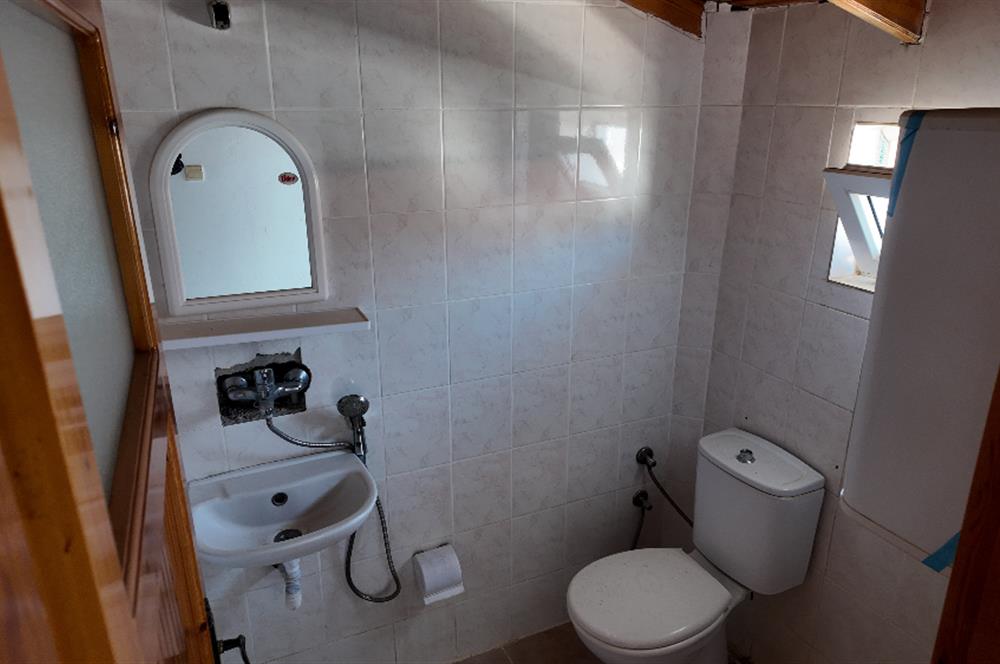 KUŞADASI MERKEZE VE PLAJA YAKIN HAVUZLU SİTEDE SATILIK 5+1 VİLLA