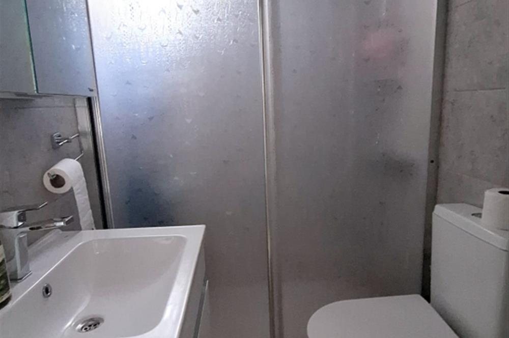 BODRUM GÜMÜŞLÜK GÜMSAN 1 SİTESİNDE YATIRIMLIK ÖZEL PLAJLI SU ARITMALI YAZLIK KIŞLIK  
