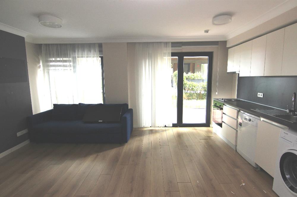 KOÇ BATI YURDUNA KOMŞU SATILIK 1+1 BAHÇELİ DAİRE