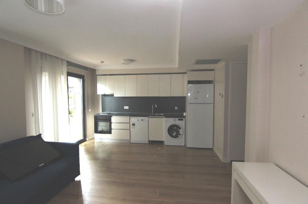 KOÇ BATI YURDUNA KOMŞU SATILIK 1+1 BAHÇELİ DAİRE