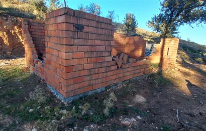 Bodrum Mazı deniz manzaralı, icerisinde kayıtlı ev bulunan satılık tarla