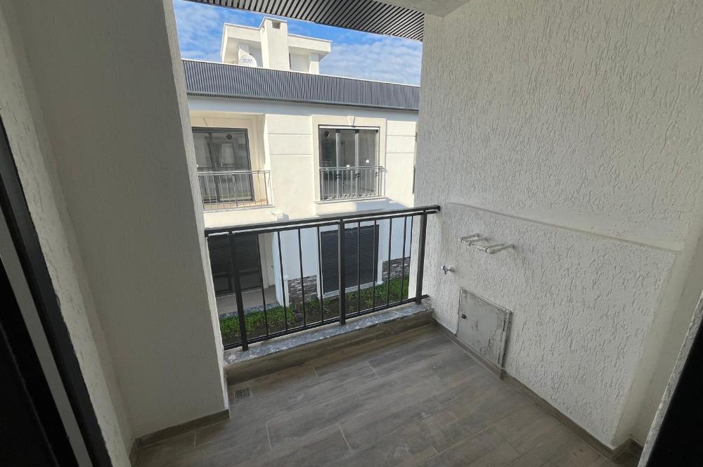 Güre Çamlıbel Zeytin Evleri’nde 1. Kat, Havuzlu, Bahçe Kullanımlı, Kapalı Otoparklı SATILIK DAİRE 1+1