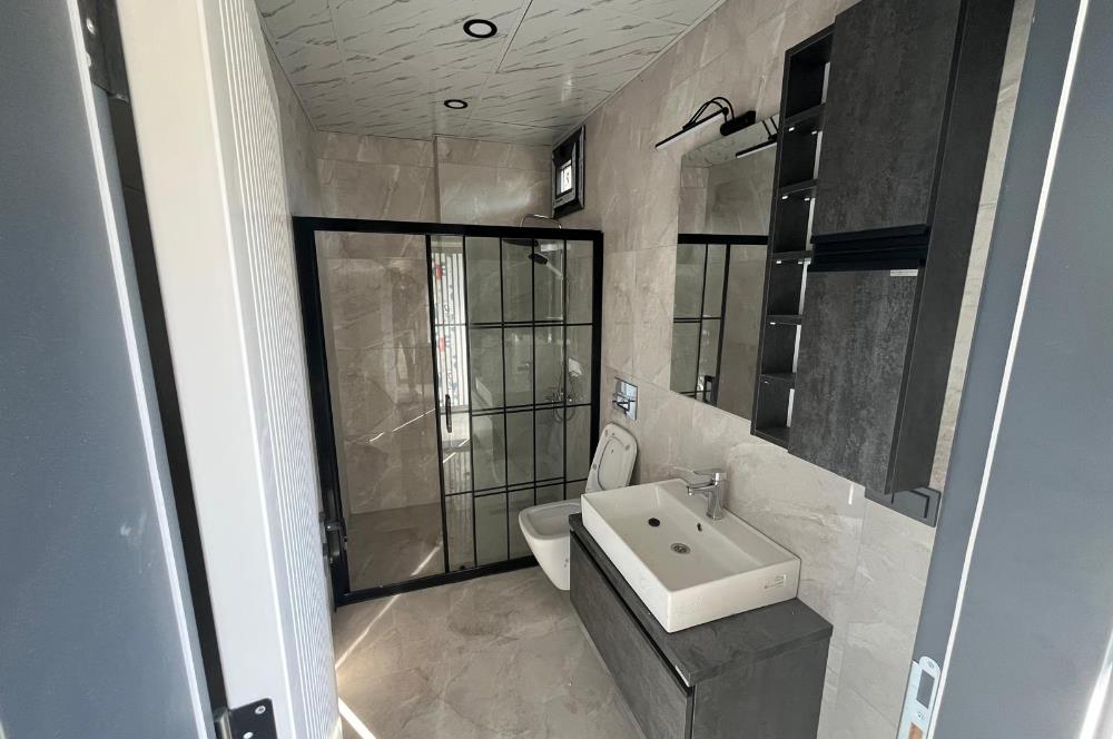 Güre Çamlıbel Zeytin Evleri’nde 1. Kat, Havuzlu, Bahçe Kullanımlı, Kapalı Otoparklı SATILIK DAİRE 1+1