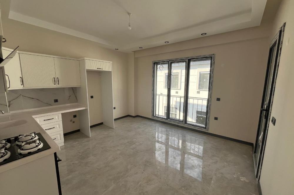 Güre Çamlıbel Zeytin Evleri’nde 1. Kat, Havuzlu, Bahçe Kullanımlı, Kapalı Otoparklı SATILIK DAİRE 1+1