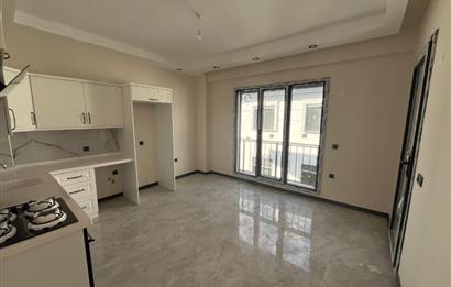 Güre Çamlıbel Zeytin Evleri’nde 1. Kat, Havuzlu, Bahçe Kullanımlı, Kapalı Otoparklı SATILIK DAİRE 1+1