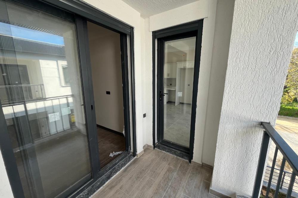 Güre Çamlıbel Zeytin Evleri’nde 1. Kat, Havuzlu, Bahçe Kullanımlı, Kapalı Otoparklı SATILIK DAİRE 1+1