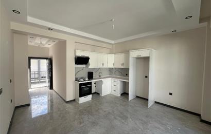 Güre Çamlıbel Zeytin Evleri’nde 1. Kat, Havuzlu, Bahçe Kullanımlı, Kapalı Otoparklı SATILIK DAİRE 1+1