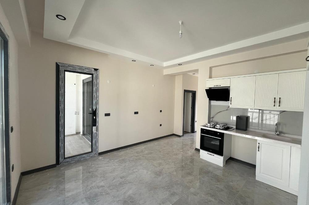 Güre Çamlıbel Zeytin Evleri’nde 1. Kat, Havuzlu, Bahçe Kullanımlı, Kapalı Otoparklı SATILIK DAİRE 1+1