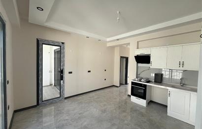 Güre Çamlıbel Zeytin Evleri’nde 1. Kat, Havuzlu, Bahçe Kullanımlı, Kapalı Otoparklı SATILIK DAİRE 1+1