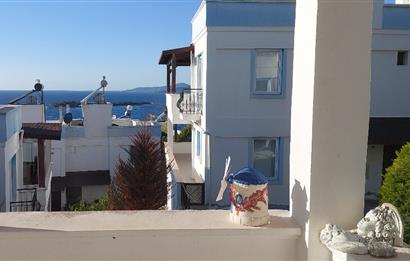 Bodrum-Adabükü özel plajlı,deniz manzaralı satılık üst dubleks daire