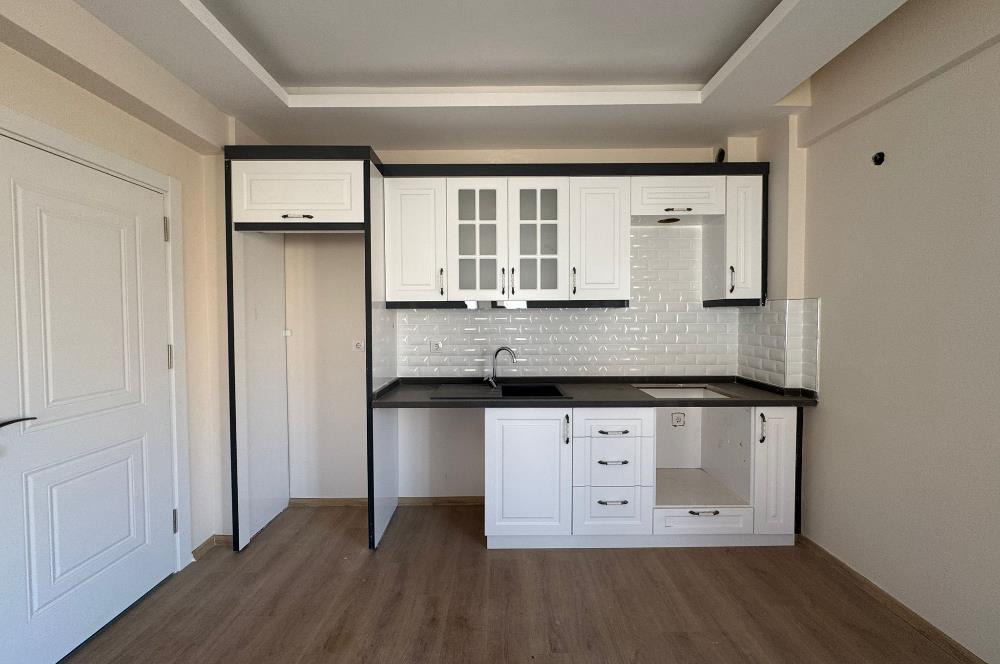 1298286656 Foça Bağarası'nda Site İçinde Sıfır Bahçe Katı Satılık 2+1 Daire 