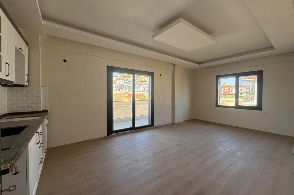 1298286656 Foça Bağarası'nda Site İçinde Sıfır Bahçe Katı Satılık 2+1 Daire 