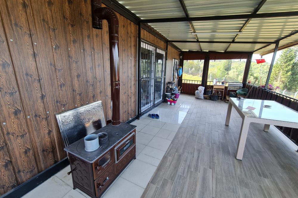 DENİZ İLE DOĞANIN BULUŞTUĞU YER ULAŞLIDA ARSA VE ÜZERİNDE YAPI