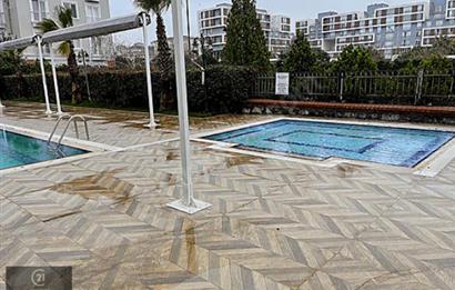 YENİŞEHİR MUTLU CİTY DE SATILIK HAVUZLU GENİŞ1+1 GİRİŞ KAT DAİRE