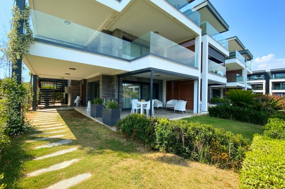Kiralık Denize Sıfır Özel Kum Plajlı ve Havuzlu Site içerisinde Bahçe Katı Residance Daire