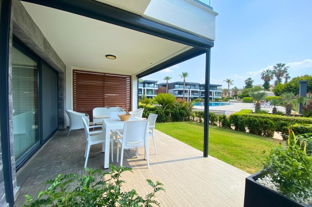 Kiralık Denize Sıfır Özel Kum Plajlı ve Havuzlu Site içerisinde Bahçe Katı Residance Daire