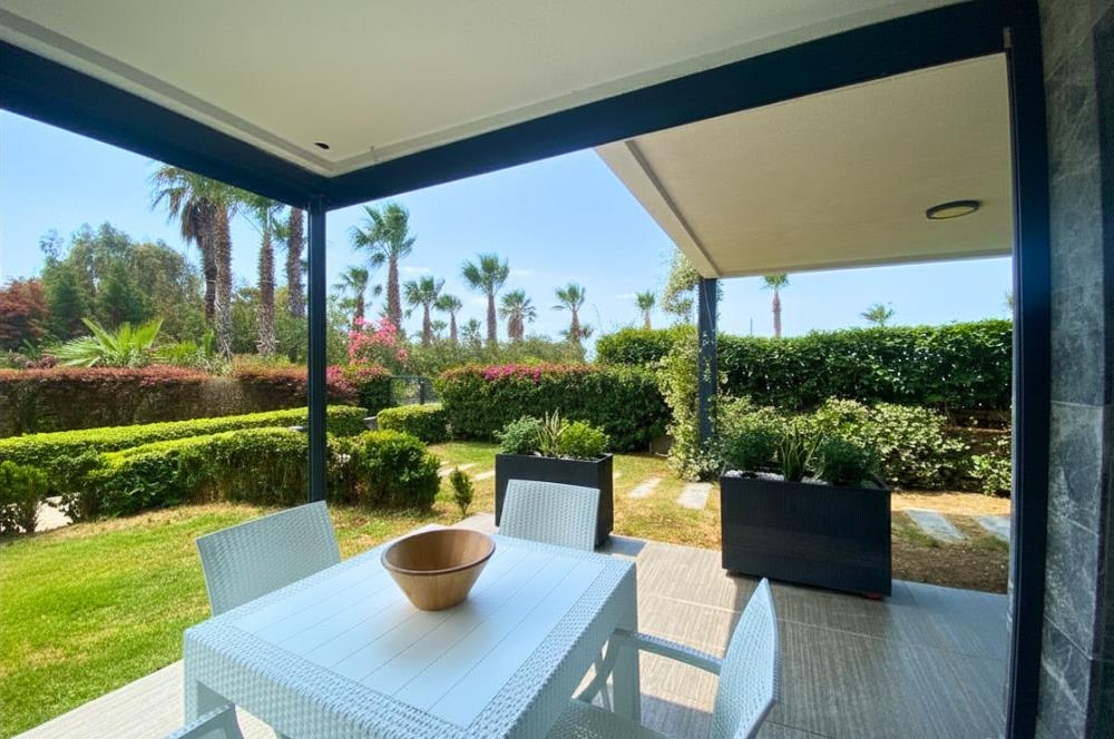 Kiralık Denize Sıfır Özel Kum Plajlı ve Havuzlu Site içerisinde Bahçe Katı Residance Daire