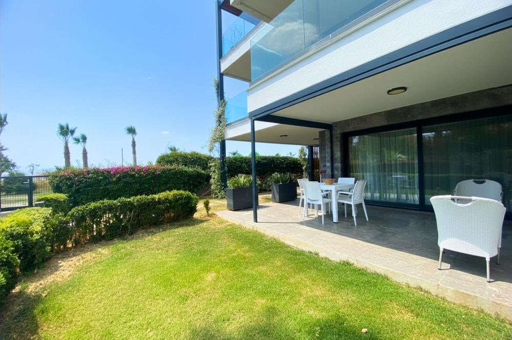 Kiralık Denize Sıfır Özel Kum Plajlı ve Havuzlu Site içerisinde Bahçe Katı Residance Daire