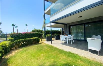 Kiralık Denize Sıfır Özel Kum Plajlı ve Havuzlu Site içerisinde Bahçe Katı Residance Daire