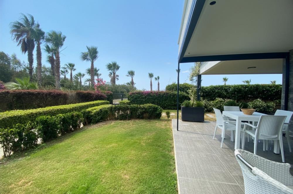 Kiralık Denize Sıfır Özel Kum Plajlı ve Havuzlu Site içerisinde Bahçe Katı Residance Daire
