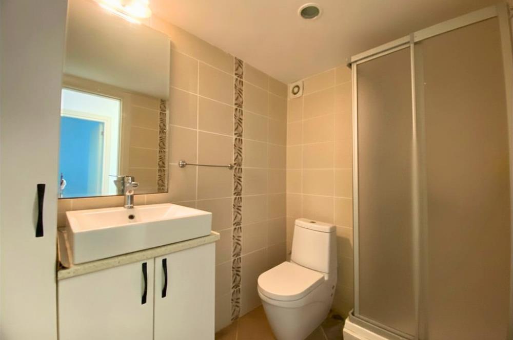 Kiralık Denize Sıfır Özel Kum Plajlı ve Havuzlu Site içerisinde Bahçe Katı Residance Daire