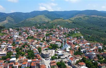 ORHANGAZİ YENİKÖY’DE, KÖYE ÇOK YAKIN-  ÇİFT YOLA CEPHE 15.096 M2 MÜSTAKİL TARLA  