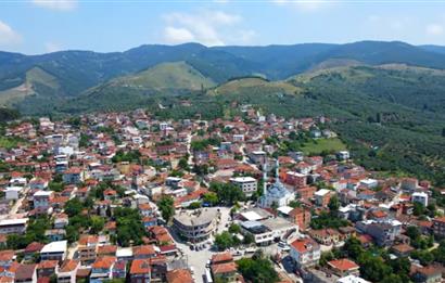 ORHANGAZİ YENİKÖY’DE, KÖYE ÇOK YAKIN-  ÇİFT YOLA CEPHE 15.096 M2 MÜSTAKİL TARLA  
