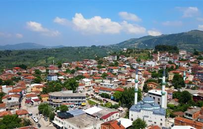 ORHANGAZİ YENİKÖY’DE, KÖYE ÇOK YAKIN-  ÇİFT YOLA CEPHE 15.096 M2 MÜSTAKİL TARLA  