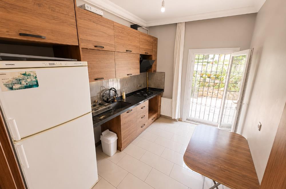 Turkuaz Apartmanı'nda Pazara Yakın, Keyifli Bahçe Katı 1+1 Daire 