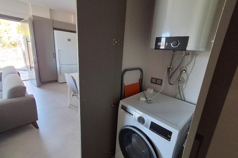 Dörttepe'de havuzlu sitede  aydan aya ödemeli 2+1 bahce katı daire