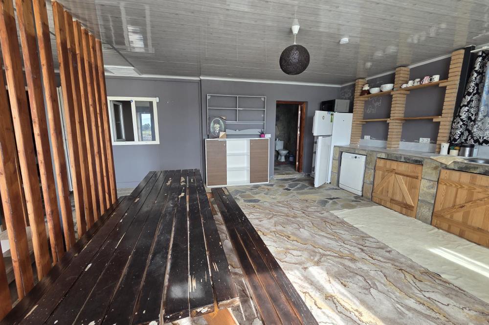Mumcular Gökyer yıllık  kiralık 1698 m2 tarla ve icerisinde 1+1 esyalı müstakil ev
