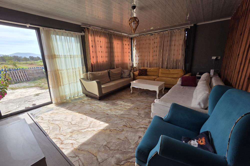 Mumcular Gökyer yıllık  kiralık 1698 m2 tarla ve icerisinde 1+1 esyalı müstakil ev