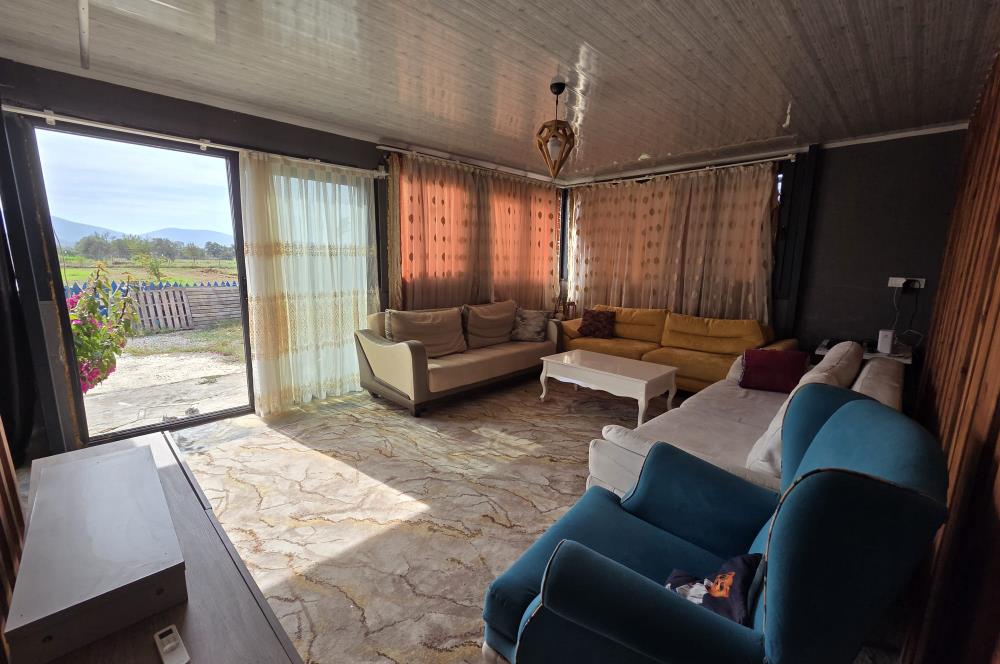 Mumcular Gökyer yıllık  kiralık 1698 m2 tarla ve icerisinde 1+1 esyalı müstakil ev