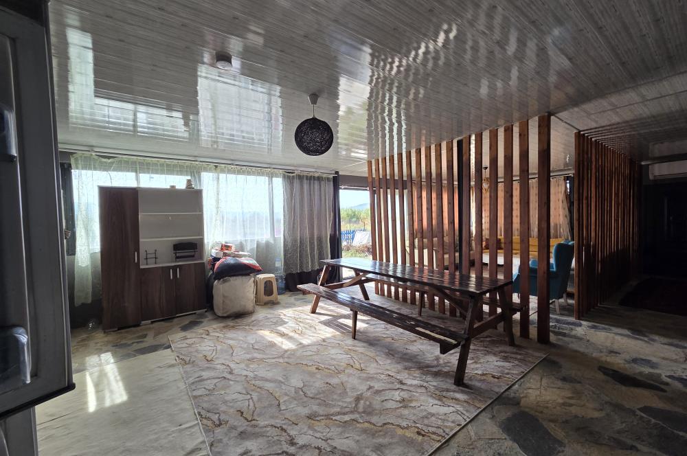 Mumcular Gökyer yıllık  kiralık 1698 m2 tarla ve icerisinde 1+1 esyalı müstakil ev